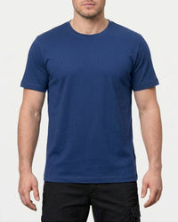 A model wears the STRAUSS Cotton Stretch T-Shirt in alkali blue with tan work pants and work boots in a studio product scene