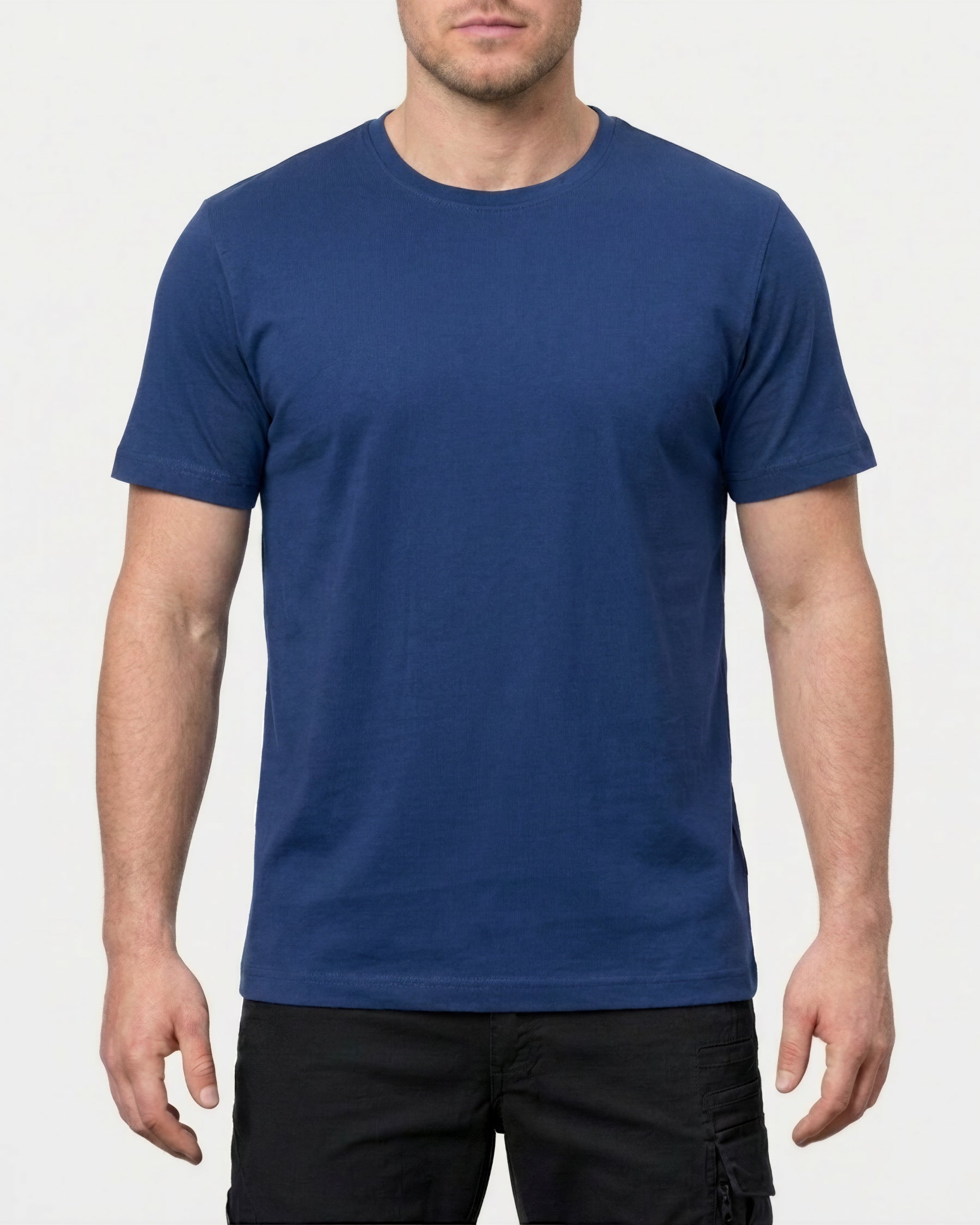 A model wears the STRAUSS Cotton Stretch T-Shirt in alkali blue with tan work pants and work boots in a studio product scene
