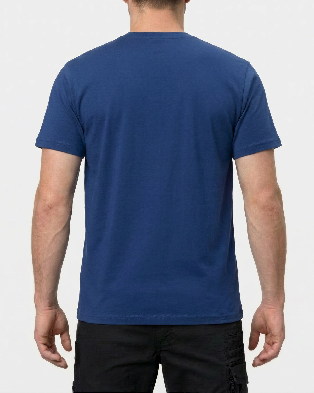 A model wears the STRAUSS Cotton Stretch T-Shirt in alkali blue with tan work pants and work boots, showing the shirt fit