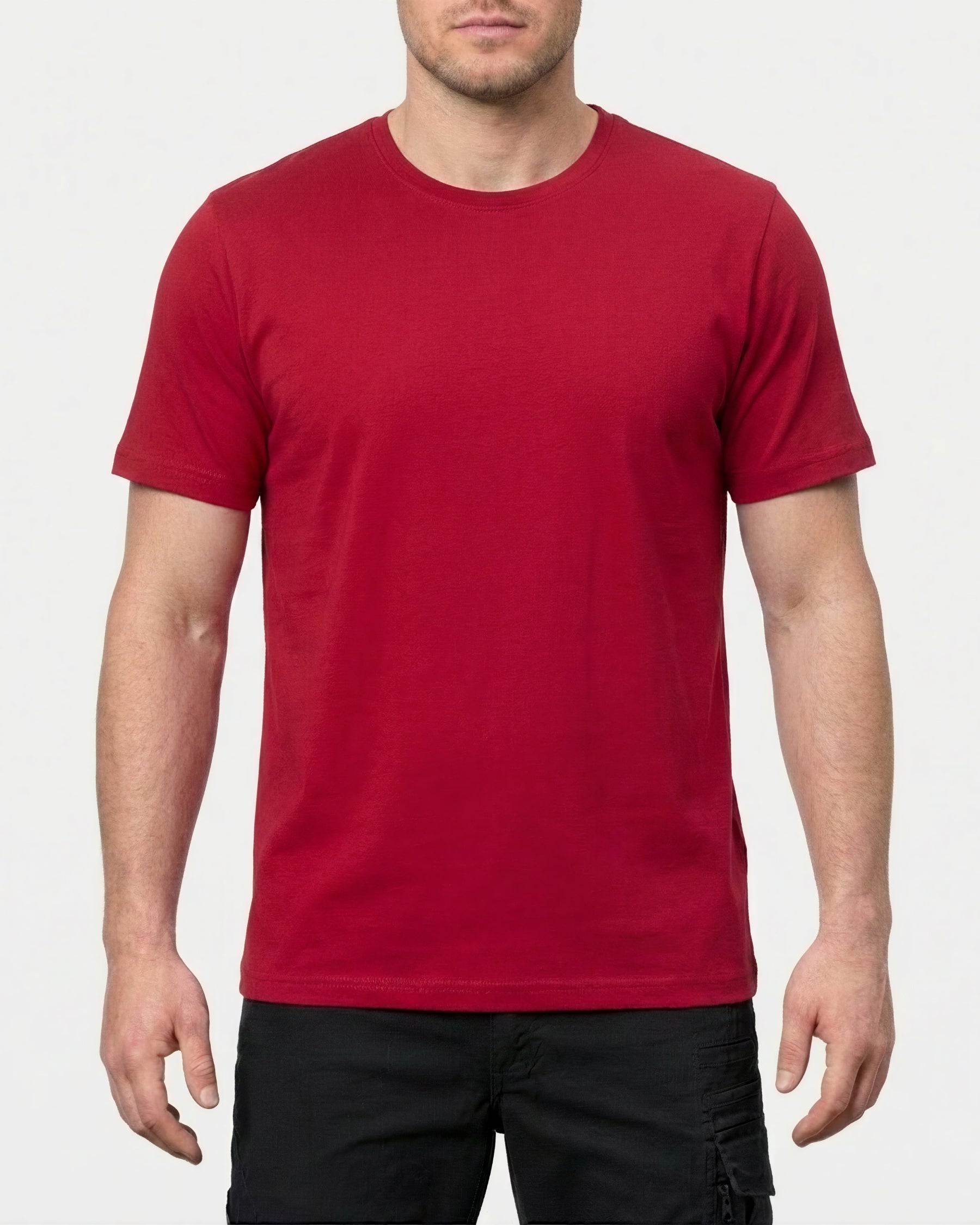 A model wears the STRAUSS Cotton Stretch T-Shirt in fire red in a studio product scene