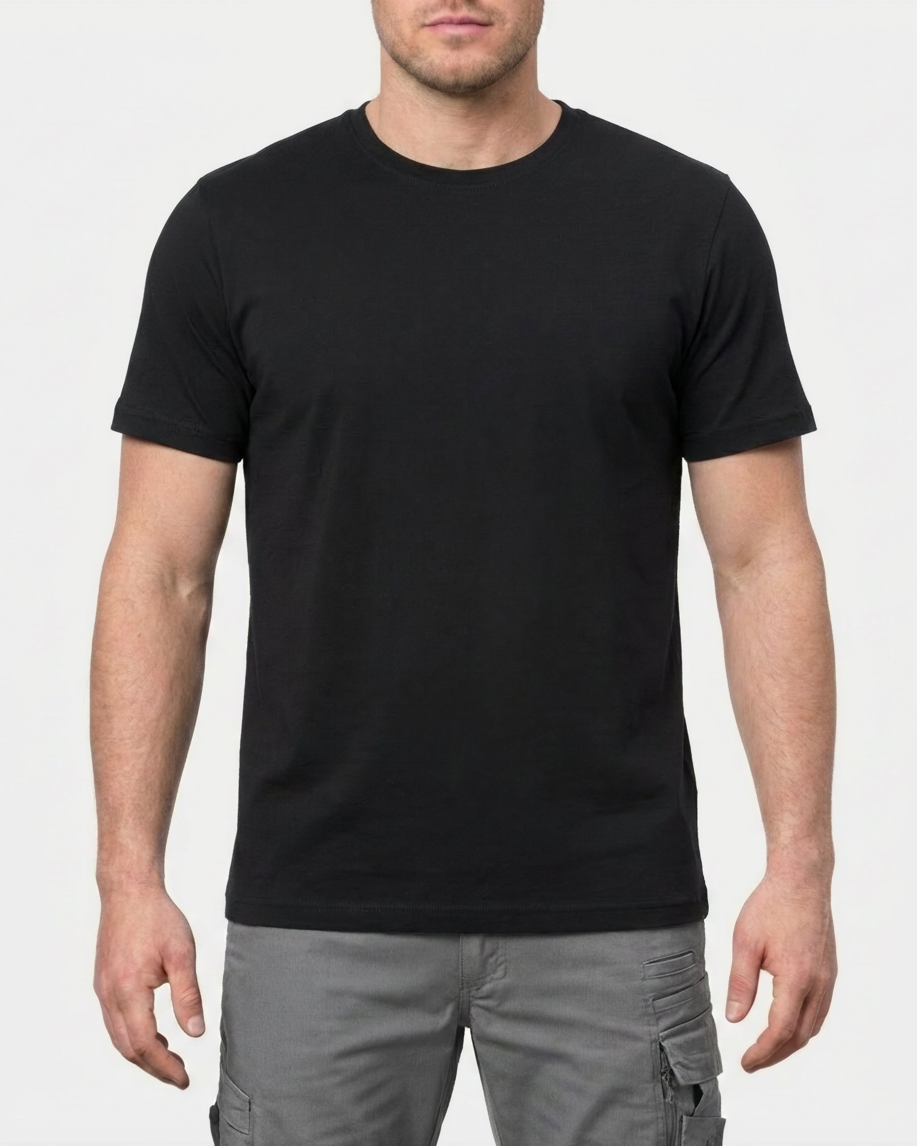 A model wears the STRAUSS Cotton Stretch T-Shirt in black in a studio product scene
