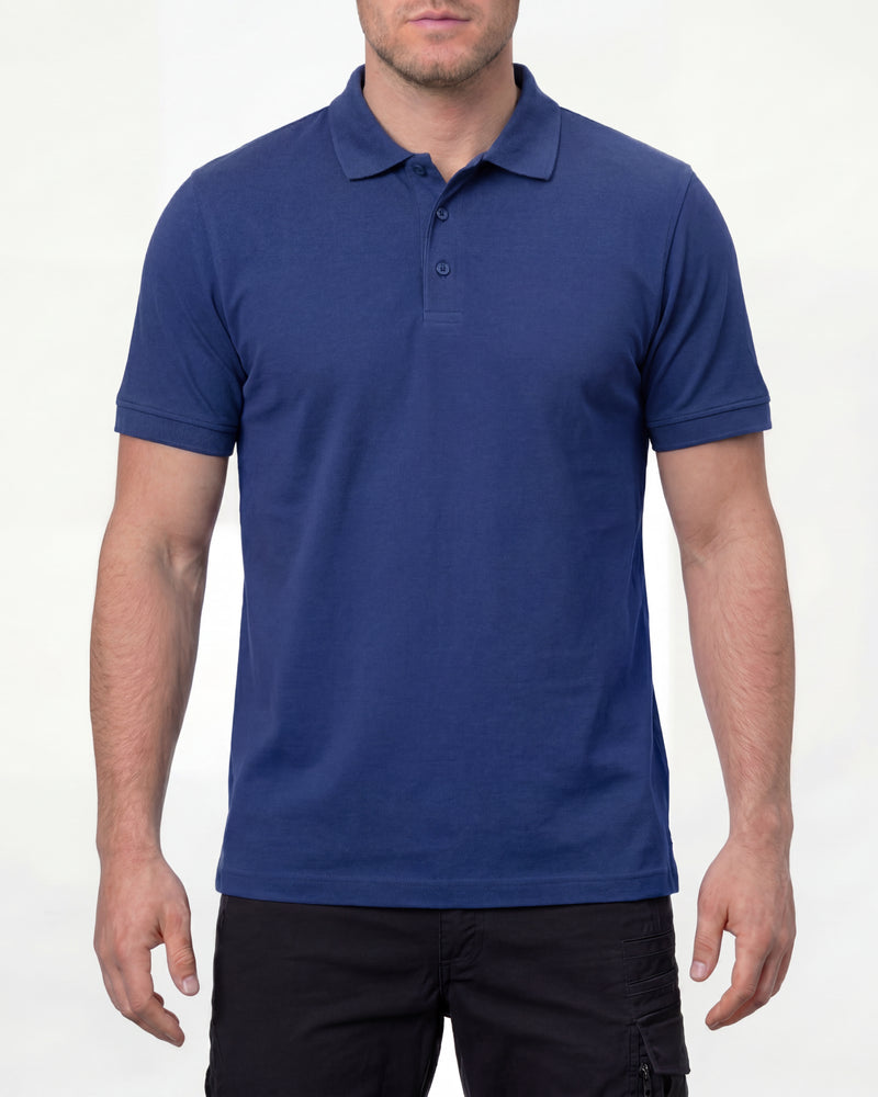 A model wears the STRAUSS Cotton Stretch Polo Shirt in royal blue with tan work pants and work boots in a studio product scene
