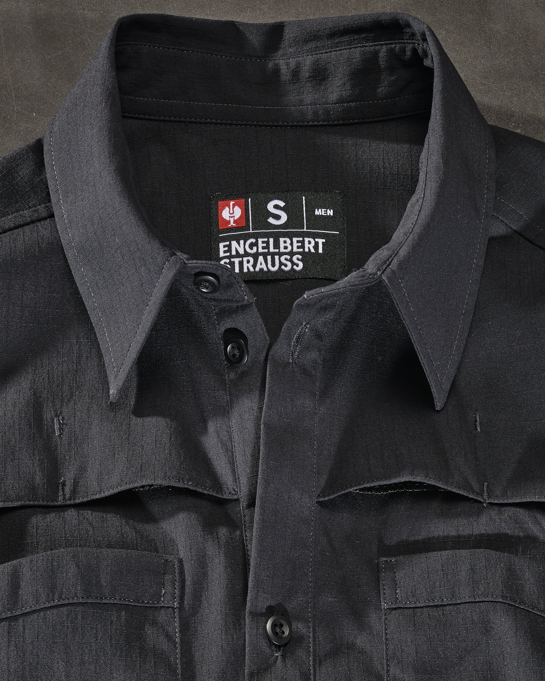 Chest pocket, snap placket, and stretch ripstop fabric on the STRAUSS e.s.taktik Stretch Ripstop Long Sleeve Work Shirt in black