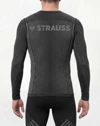 A model wears the STRAUSS e.s.trail pure Warm Seamless Thermal Long Sleeve Shirt in black and basalt gray as a cold-weather base layer, showing the shirt fit