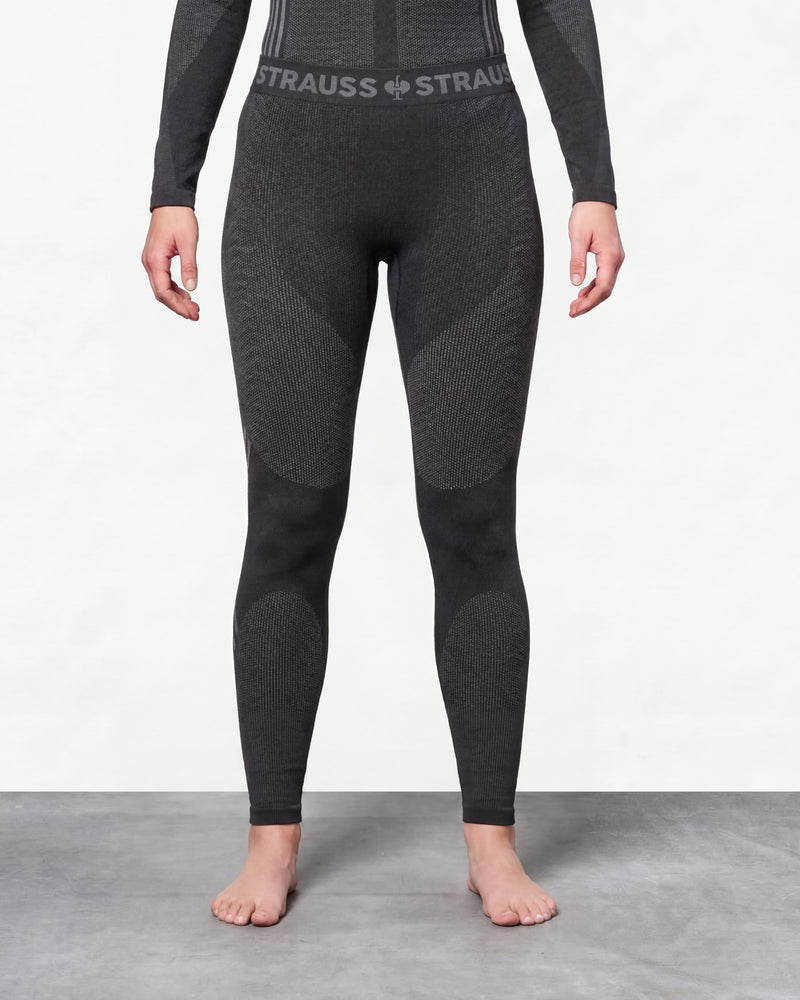 Women's Warm Seamless Thermal Pants e.s.trail pure in black/basalt gray worn by a model, front view