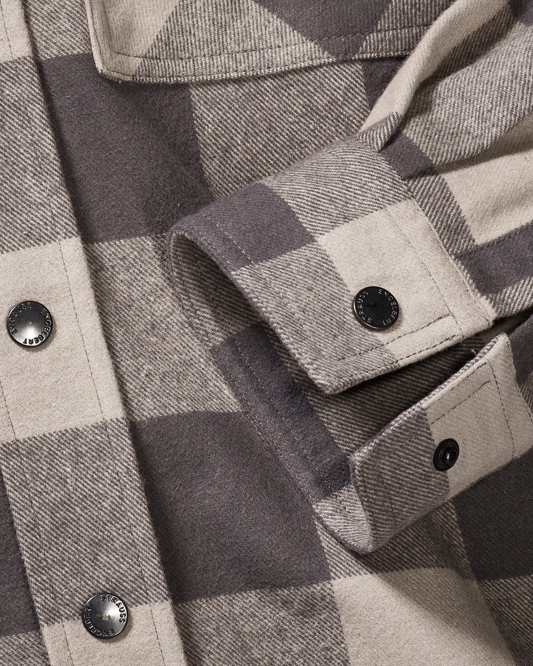 Plaid flannel fabric, button placket, and chest pocket on the STRAUSS e.s.iconic Flannel Work Shirt in dolphin gray and carbon gray