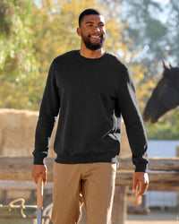 STRAUSS cotton-poly crew neck sweatshirt in black, worn in lifestyle setting