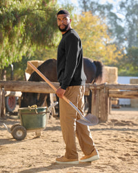 STRAUSS cotton-poly crew neck sweatshirt in black, worn in workwear outfit