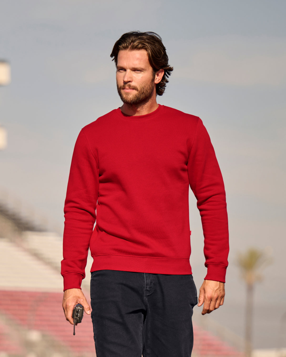 STRAUSS cotton-poly crew neck sweatshirt in fire red, worn in lifestyle setting