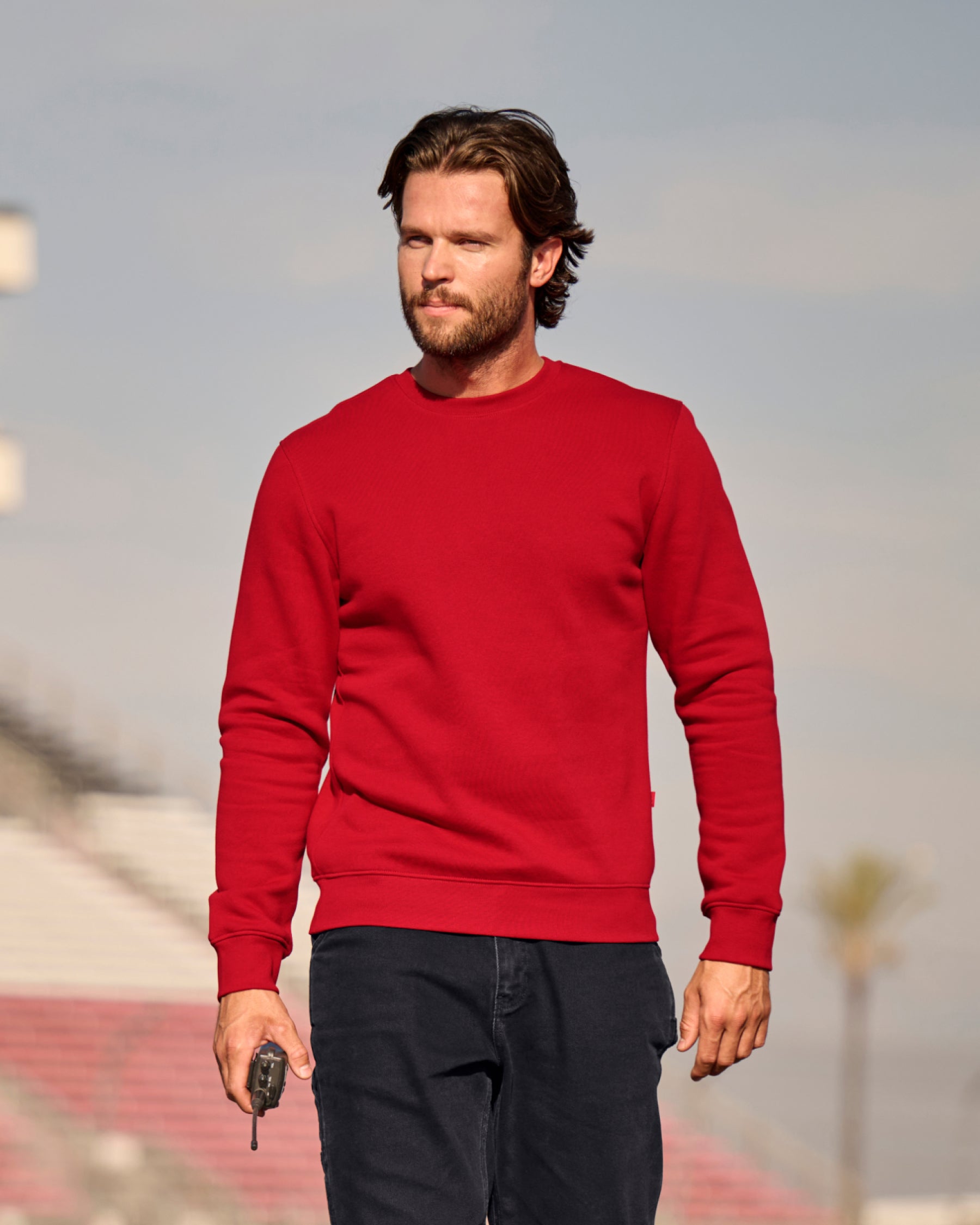 STRAUSS cotton-poly crew neck sweatshirt in fire red, worn in lifestyle setting