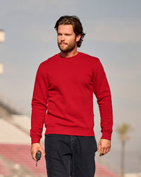 STRAUSS cotton-poly crew neck sweatshirt in fire red, worn in lifestyle setting