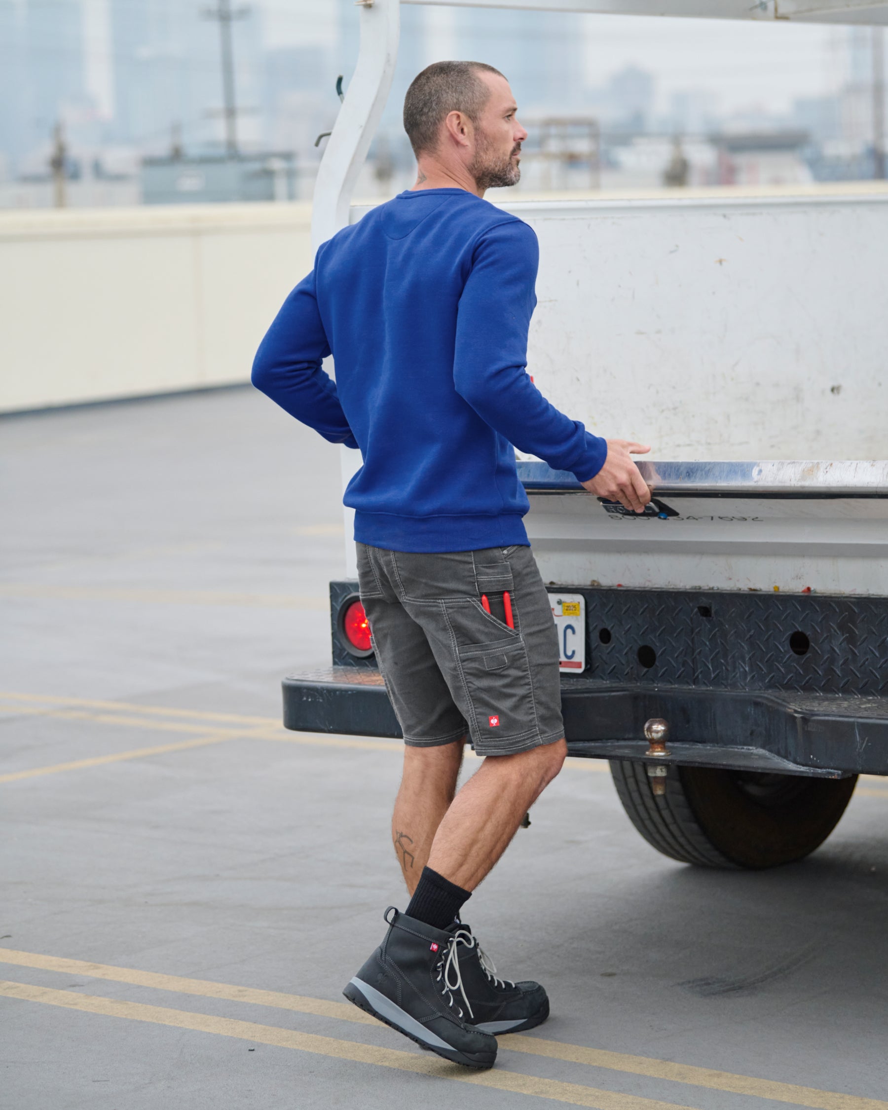 STRAUSS cotton-poly crew neck sweatshirt in royal blue, worn in workwear outfit