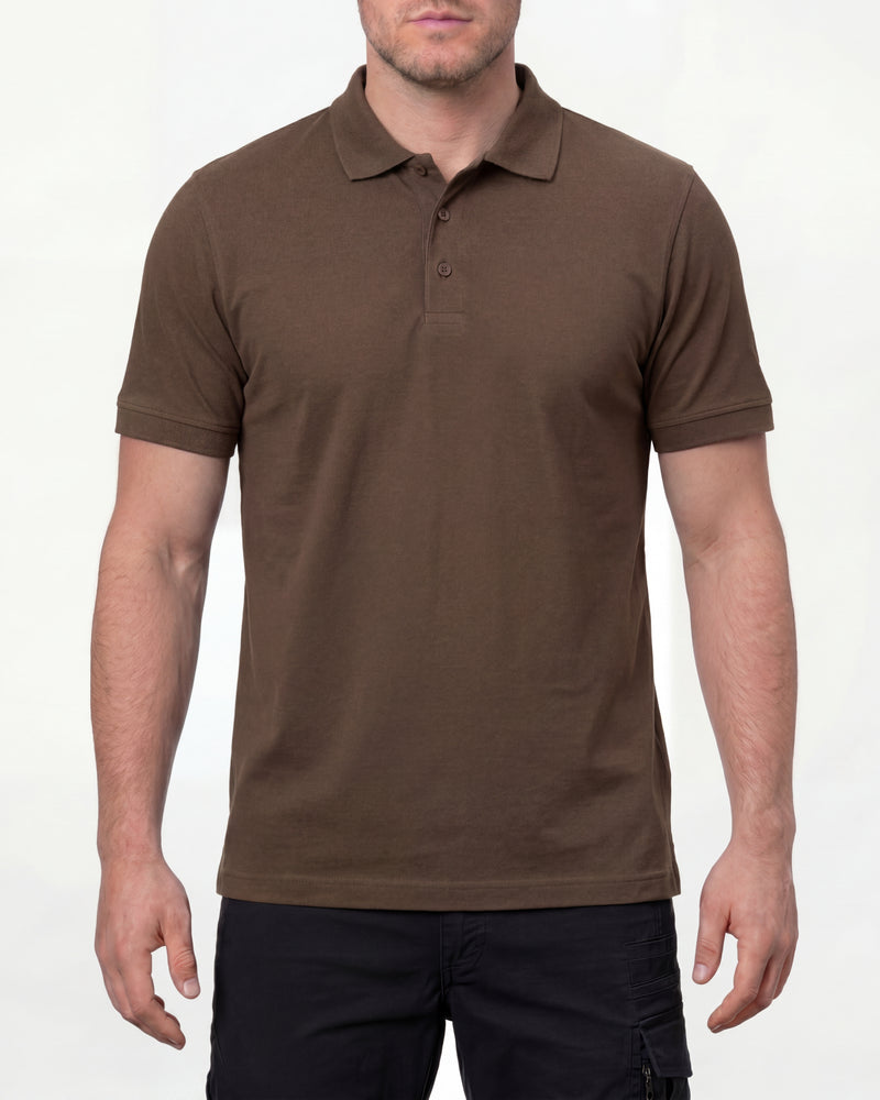 A model wears the STRAUSS Cotton Polo Shirt in hazelnut with tan work pants and work boots in a studio product scene
