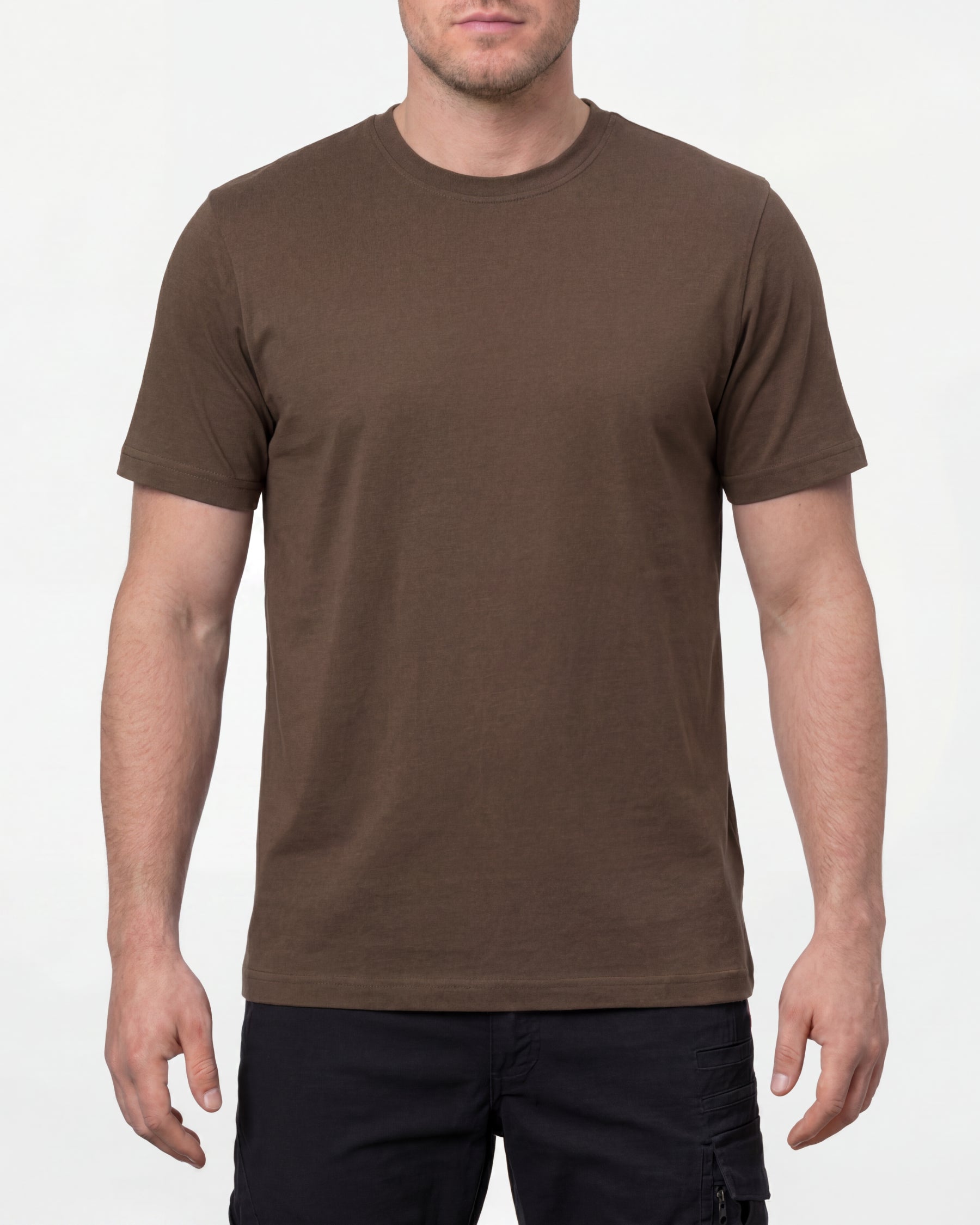 A model wears the STRAUSS Cotton T-Shirt in hazelnut with tan work pants and work boots in a studio product scene