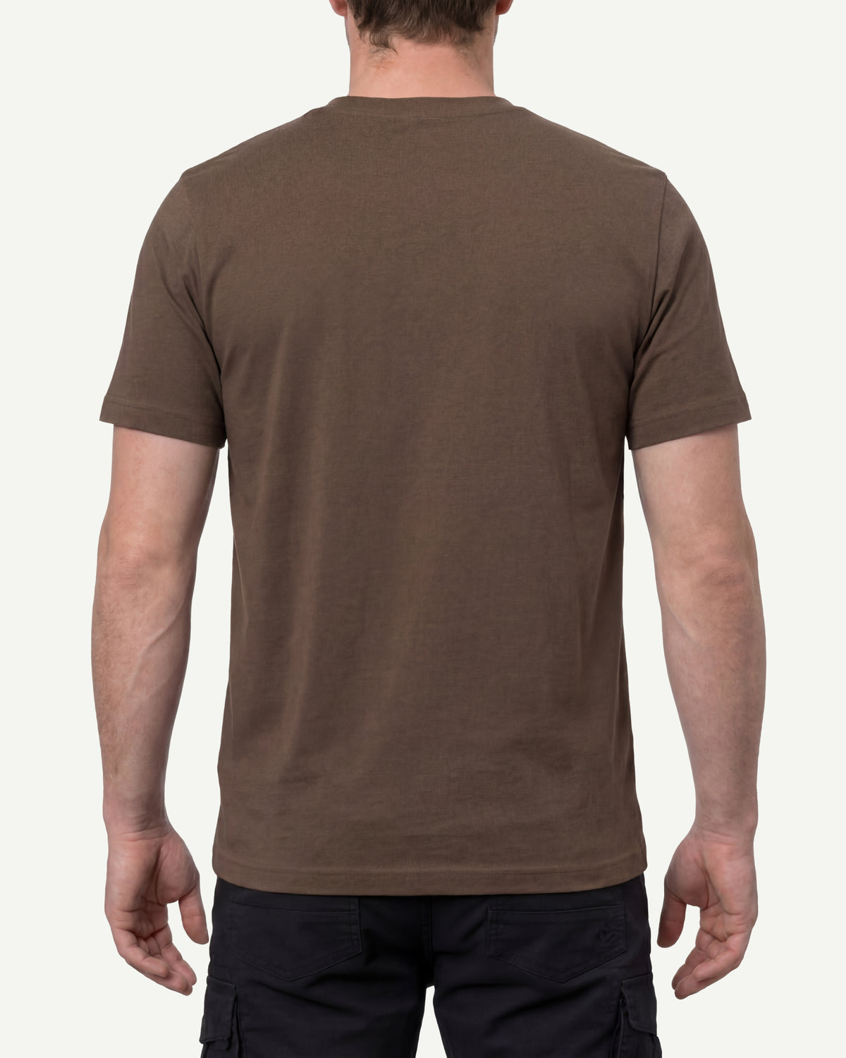A model wears the STRAUSS Cotton T-Shirt in hazelnut with tan work pants and work boots, showing the shirt fit