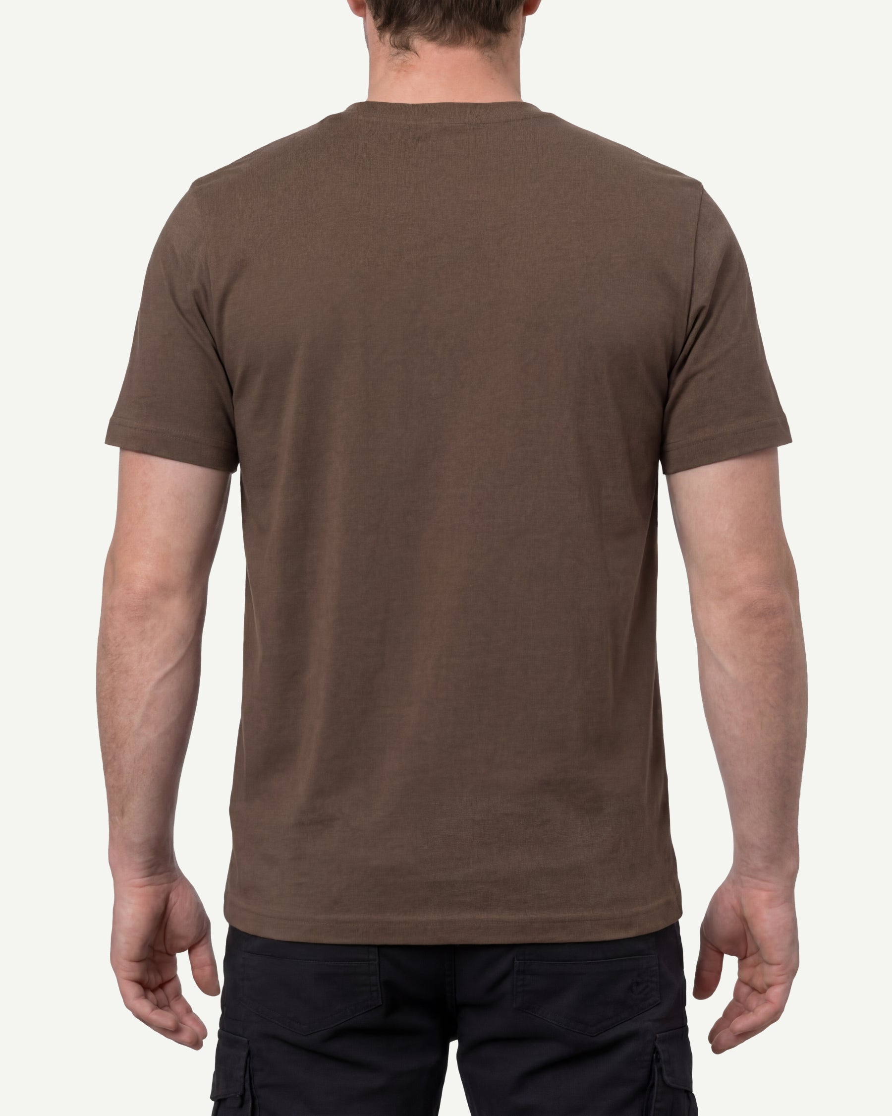 A model wears the STRAUSS Cotton T-Shirt in hazelnut with tan work pants and work boots, showing the shirt fit