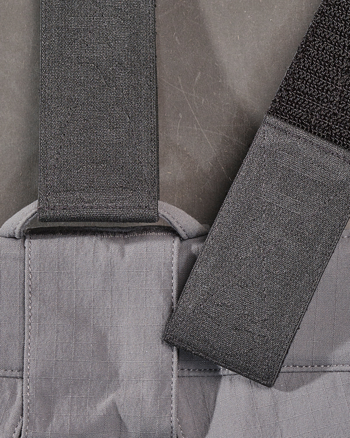 Close-up of the adjustable straps, clips, and stitching on the black STRAUSS e.s.taktik Y-back suspenders.