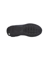 The black rubber outsole of a shoe, showing its tread pattern and a small white logo on the heel, isolated on a white background.