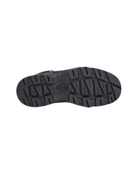 A top-down view of a black rubber shoe sole with a textured tread pattern, shown against a plain white background.