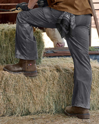 STRAUSS Doonan 12-inch Composite Toe Work Boot in Brown with workwear in a jobsite scene