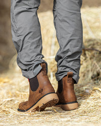 STRAUSS Woodford 6-inch Composite Toe Chelsea Boot in Carob brown worn in an outdoor work setting