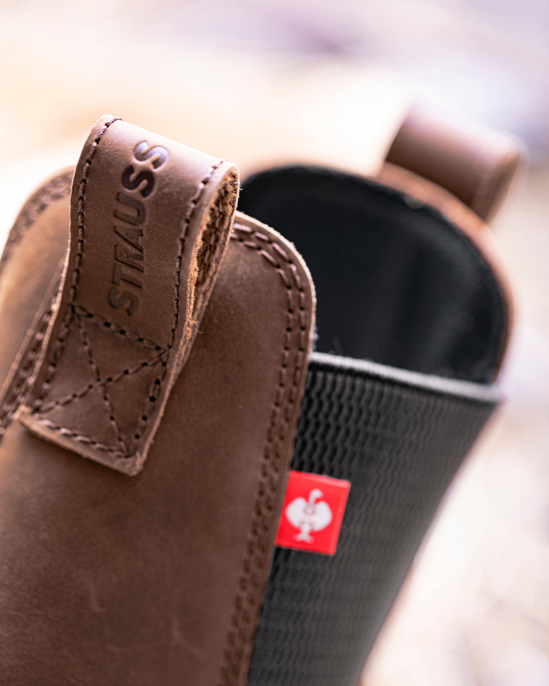 Close-up of the Carob brown Woodford 6-inch Composite Toe Chelsea Boot elastic side panel and upper
