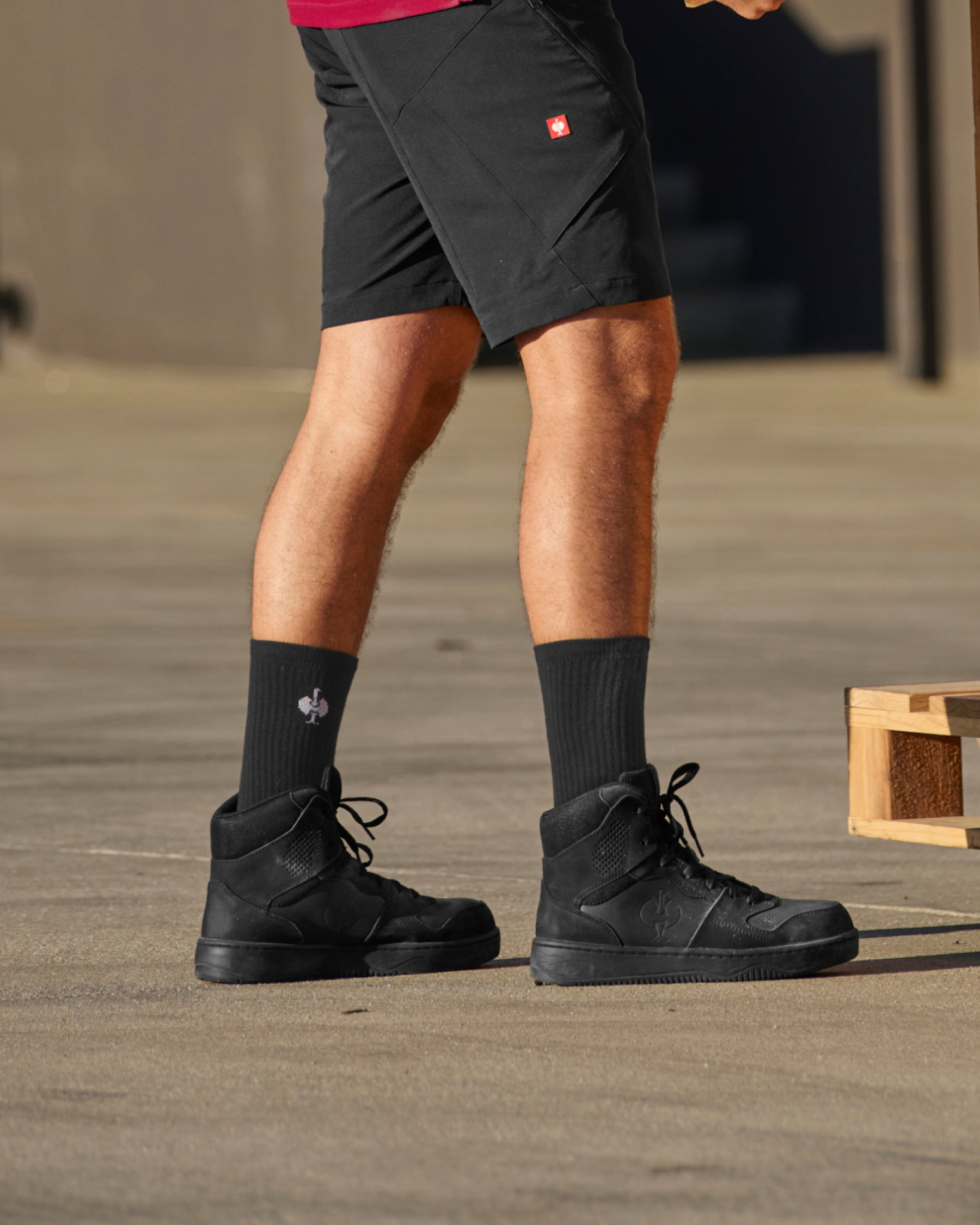 STRAUSS Eindhoven 6-inch Steel Toe Work Boot in Black shown on rough jobsite ground