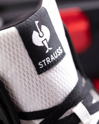 STRAUSS Eindhoven 6-inch Steel Toe Work Boot in Black and White shown in use on the job