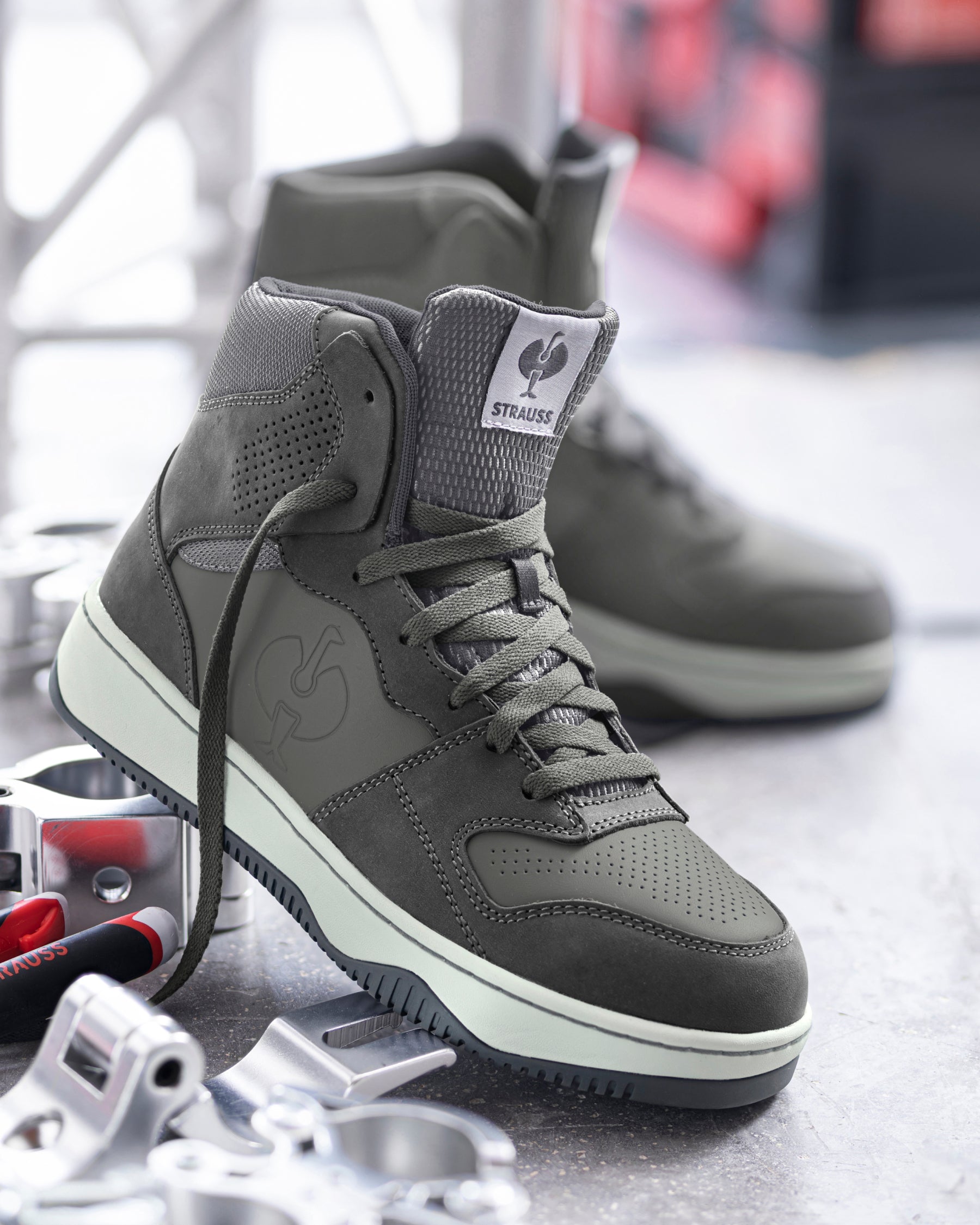 STRAUSS Eindhoven 6-inch Steel Toe Work Boot in Carbon gray with workwear in a jobsite scene