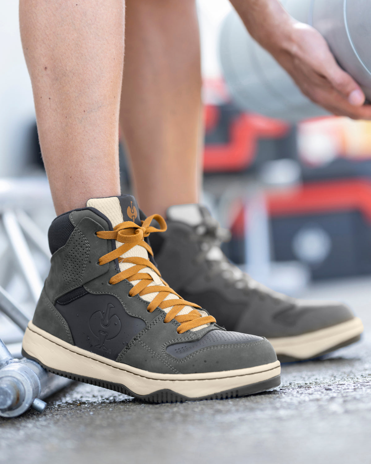 STRAUSS Eindhoven 6-inch Steel Toe Work Boot in Carbon gray and Nero blue shown on rough jobsite ground