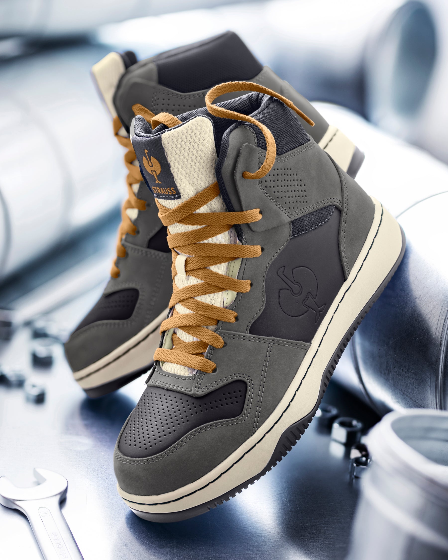 STRAUSS Eindhoven 6-inch Steel Toe Work Boot in Carbon gray and Nero blue with workwear in a jobsite scene