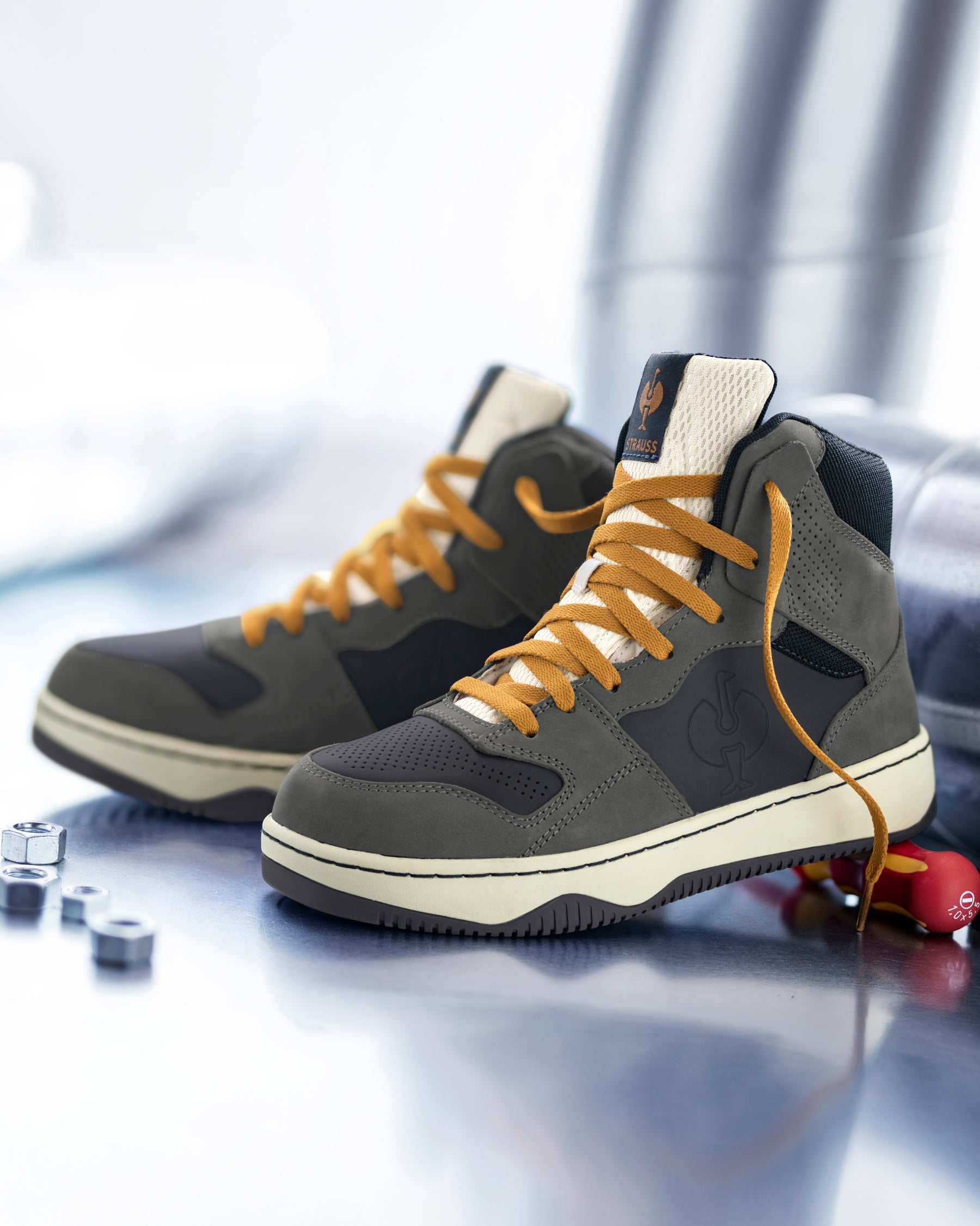 STRAUSS Eindhoven 6-inch Steel Toe Work Boot in Carbon gray and Nero blue shown in use on the job