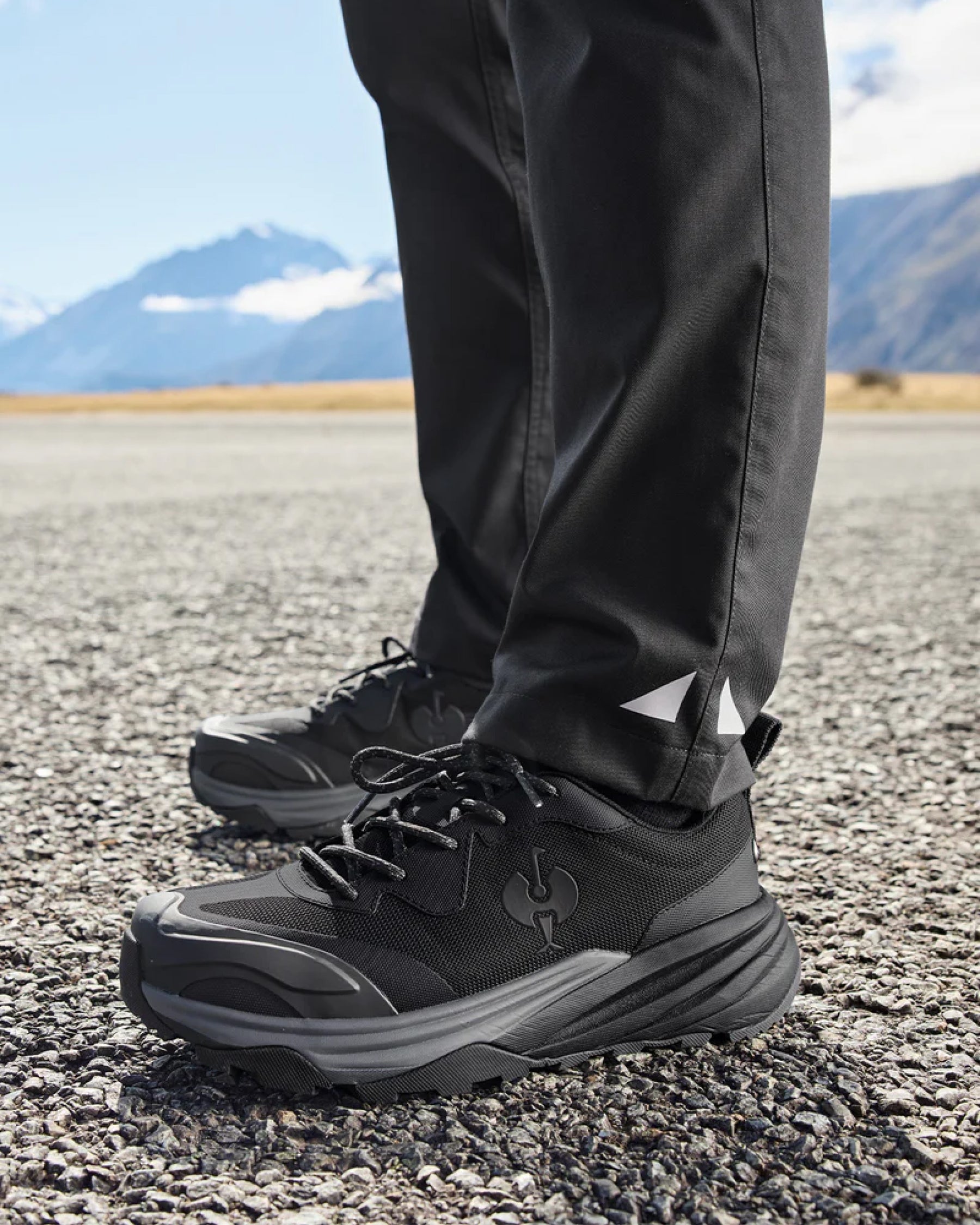 STRAUSS Harlem Composite Toe Work Shoe in Black shown on rough jobsite ground