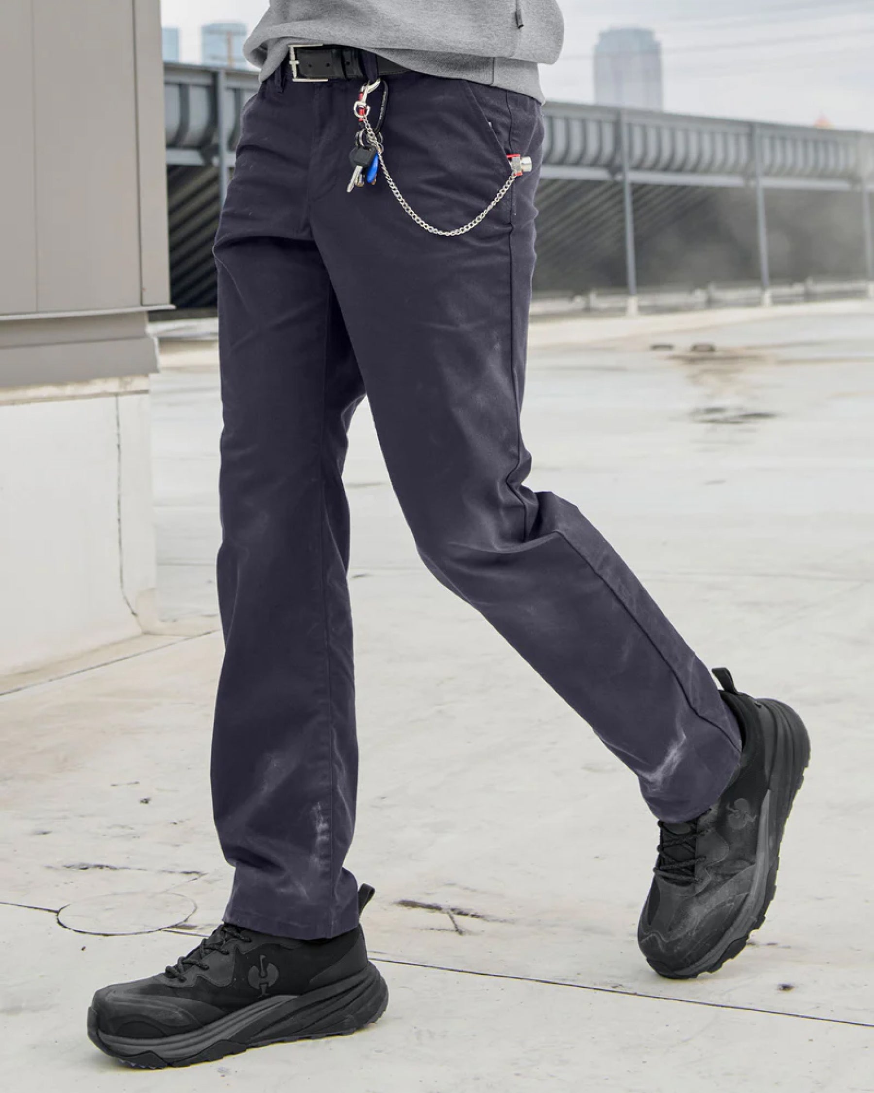 STRAUSS Harlem Composite Toe Work Shoe in Black worn in an outdoor work setting