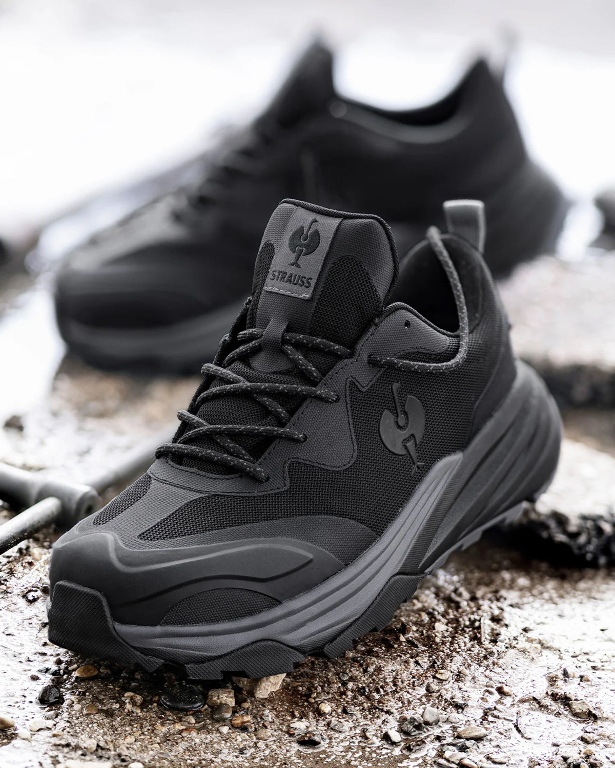 STRAUSS Harlem Composite Toe Work Shoe in Black with workwear in a jobsite scene
