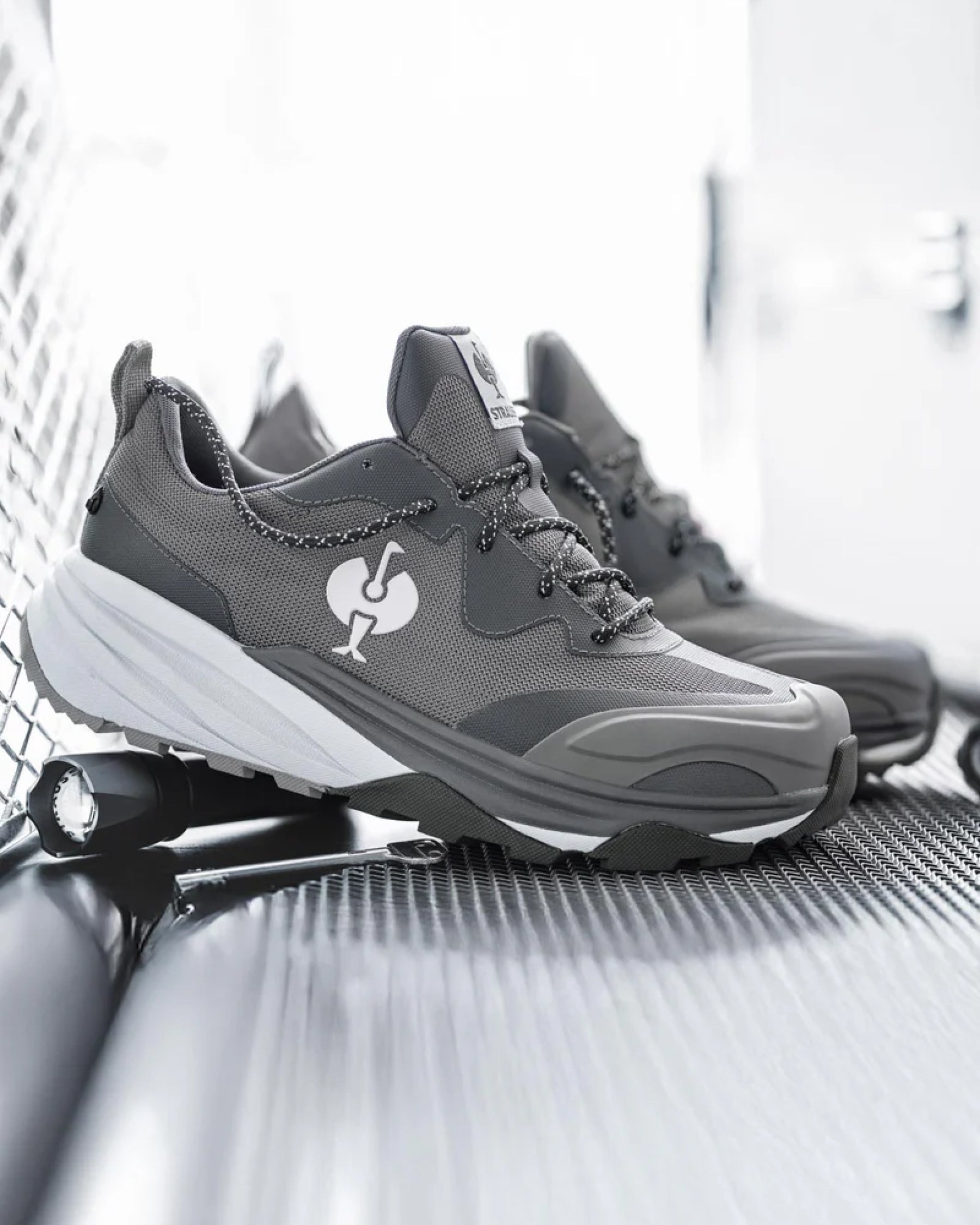 STRAUSS Harlem Composite Toe Work Shoe in Basalt gray with workwear in a jobsite scene