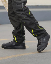 STRAUSS Philly Steel Toe Work Shoe in Black shown on rough jobsite ground