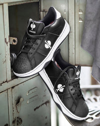 STRAUSS Philly Steel Toe Work Shoe in Black and White worn in an outdoor work setting