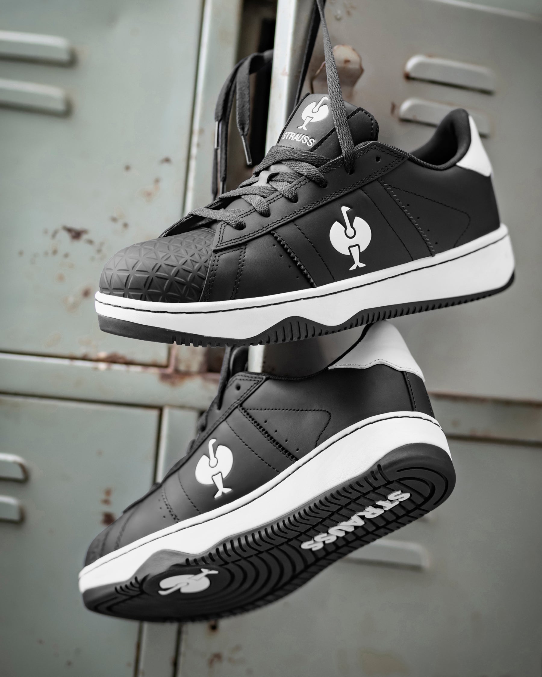 STRAUSS Philly Steel Toe Work Shoe in Black and White with workwear in a jobsite scene