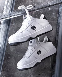 STRAUSS Philly Steel Toe Work Shoe in White and Black worn in an outdoor work setting