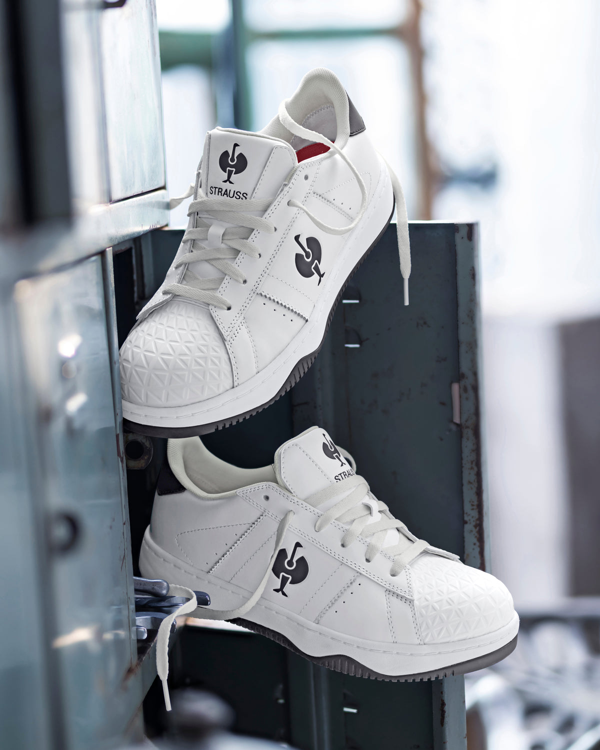 STRAUSS Philly Steel Toe Work Shoe in White and Black with workwear in a jobsite scene