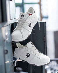 STRAUSS Philly Steel Toe Work Shoe in White and Black with workwear in a jobsite scene