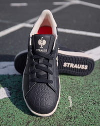 STRAUSS Philly Steel Toe Work Shoe in Nero blue shown on rough jobsite ground