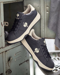 STRAUSS Philly Steel Toe Work Shoe in Nero blue with workwear in a jobsite scene