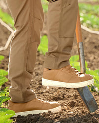 STRAUSS Philly Steel Toe Work Shoe in Almond brown shown on rough jobsite ground
