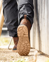 STRAUSS Woodside 6-inch Steel Toe Work Boot in Desert brown worn in an outdoor work setting