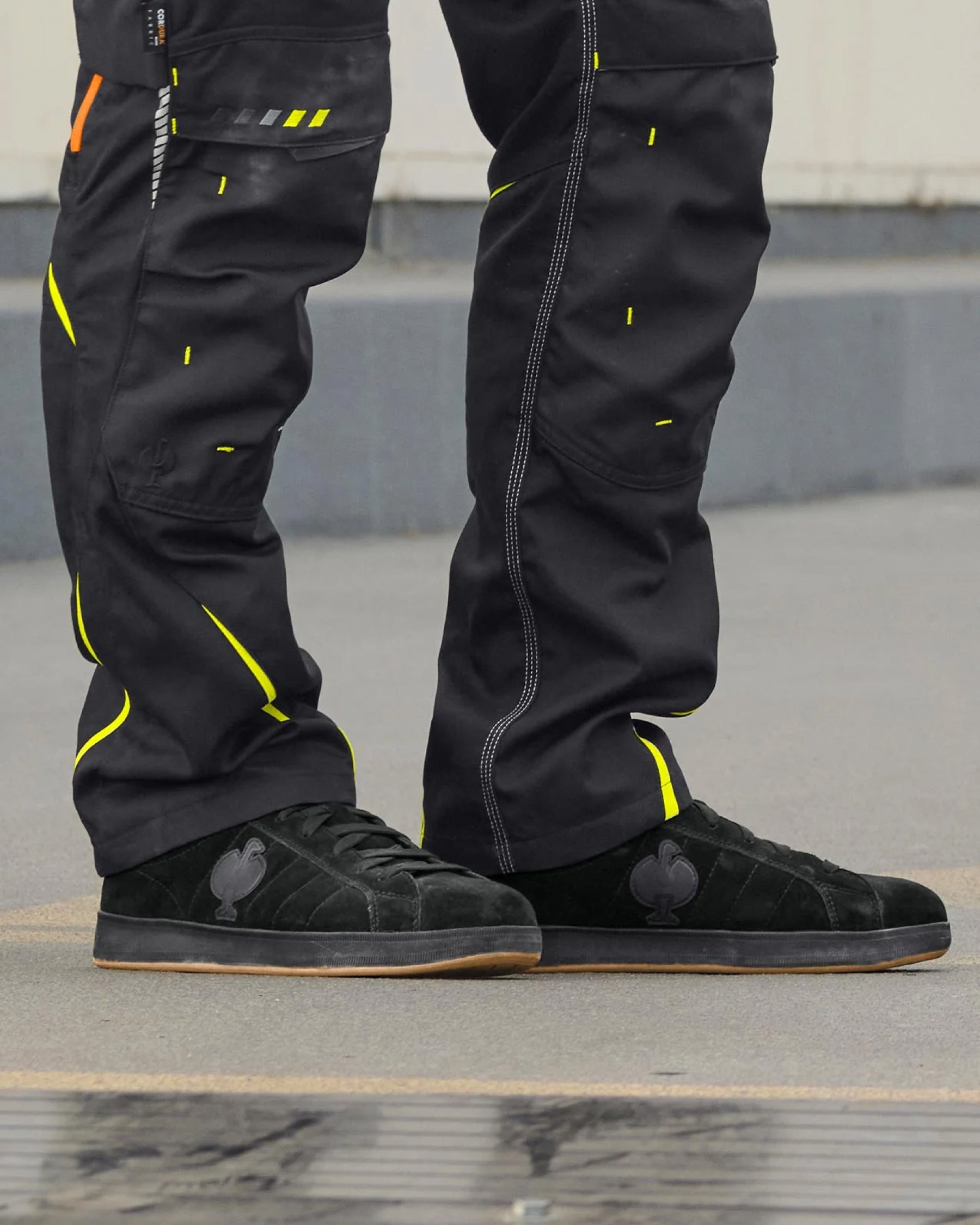 STRAUSS Tampa Steel Toe Work Shoe in Black shown on rough jobsite ground