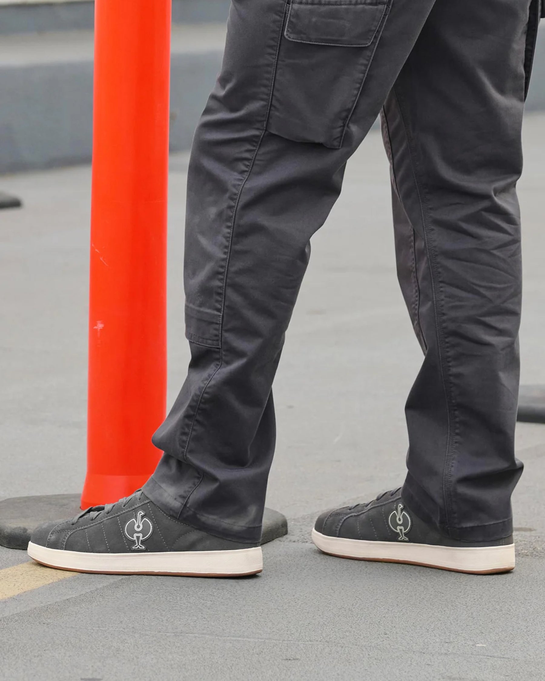 STRAUSS Tampa Steel Toe Work Shoe in Carbon gray worn in an outdoor work setting