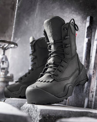 STRAUSS Edmonton 8-inch Steel Toe Work Boot in Black shown on rough jobsite ground