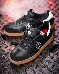 STRAUSS Brooklyn Steel Toe Work Shoe in Black and White with workwear in a jobsite scene